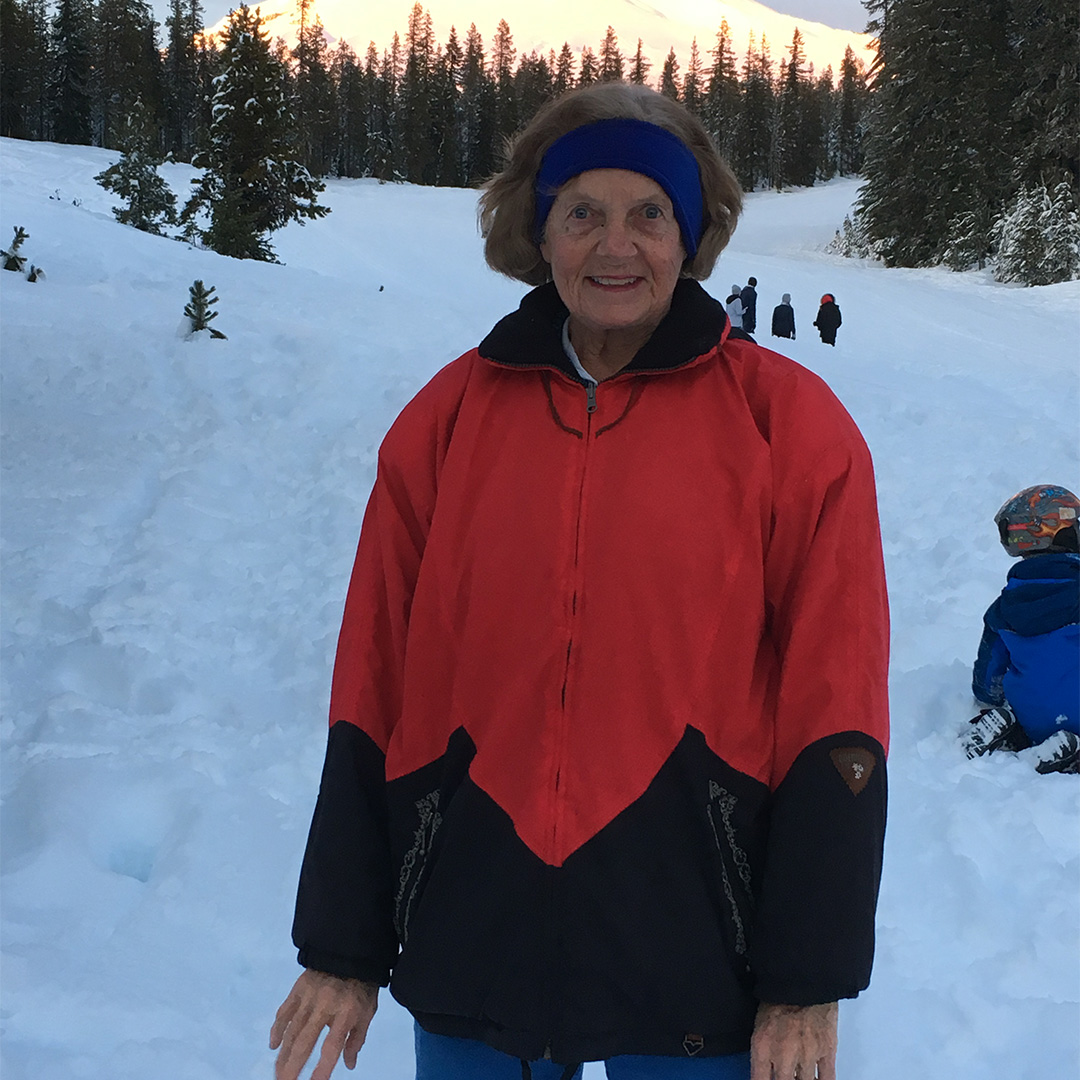 Barbara Kuehner pictured in front of a snow covered mountain
